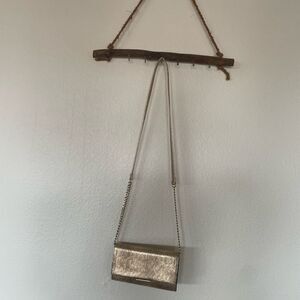 Metallic snake print crossbody bag